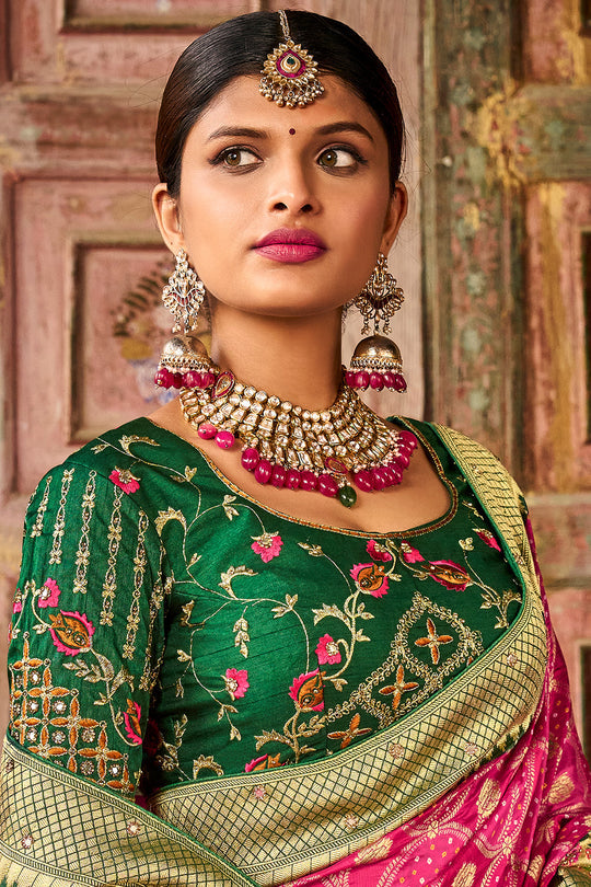 Pink pure silk saree with heavy aanchal golden border and green printed blouse (Unstitched)