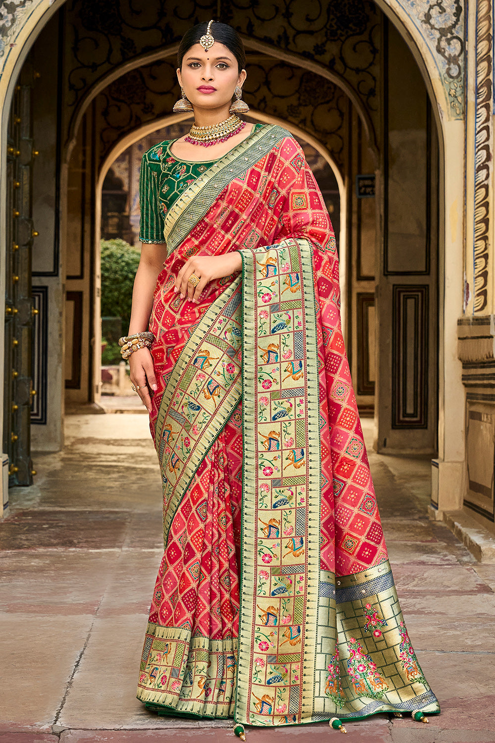 Red pure silk saree with heavy aanchal golden border and green printed blouse (Unstitched)