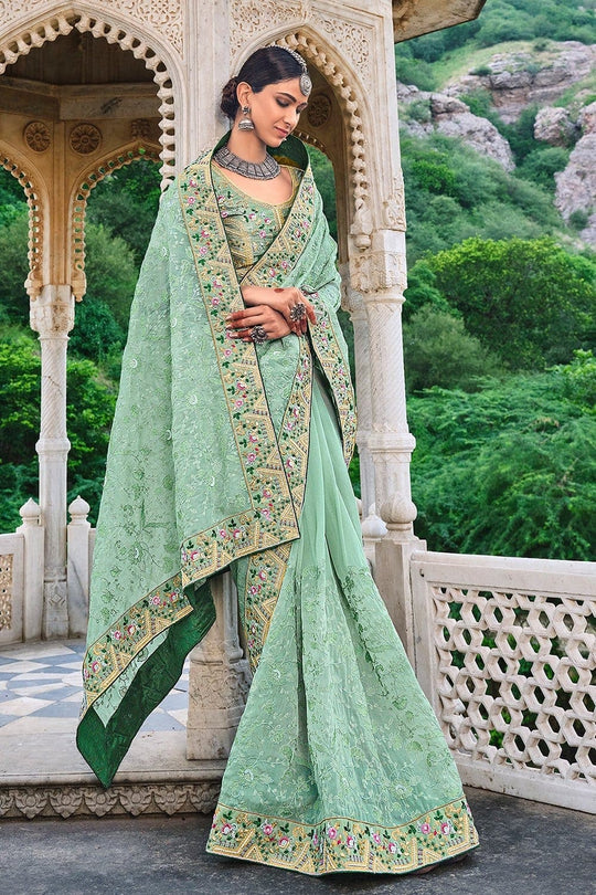 Green pure silk saree with heavy aanchal golden border and printed blouse (Unstitched)