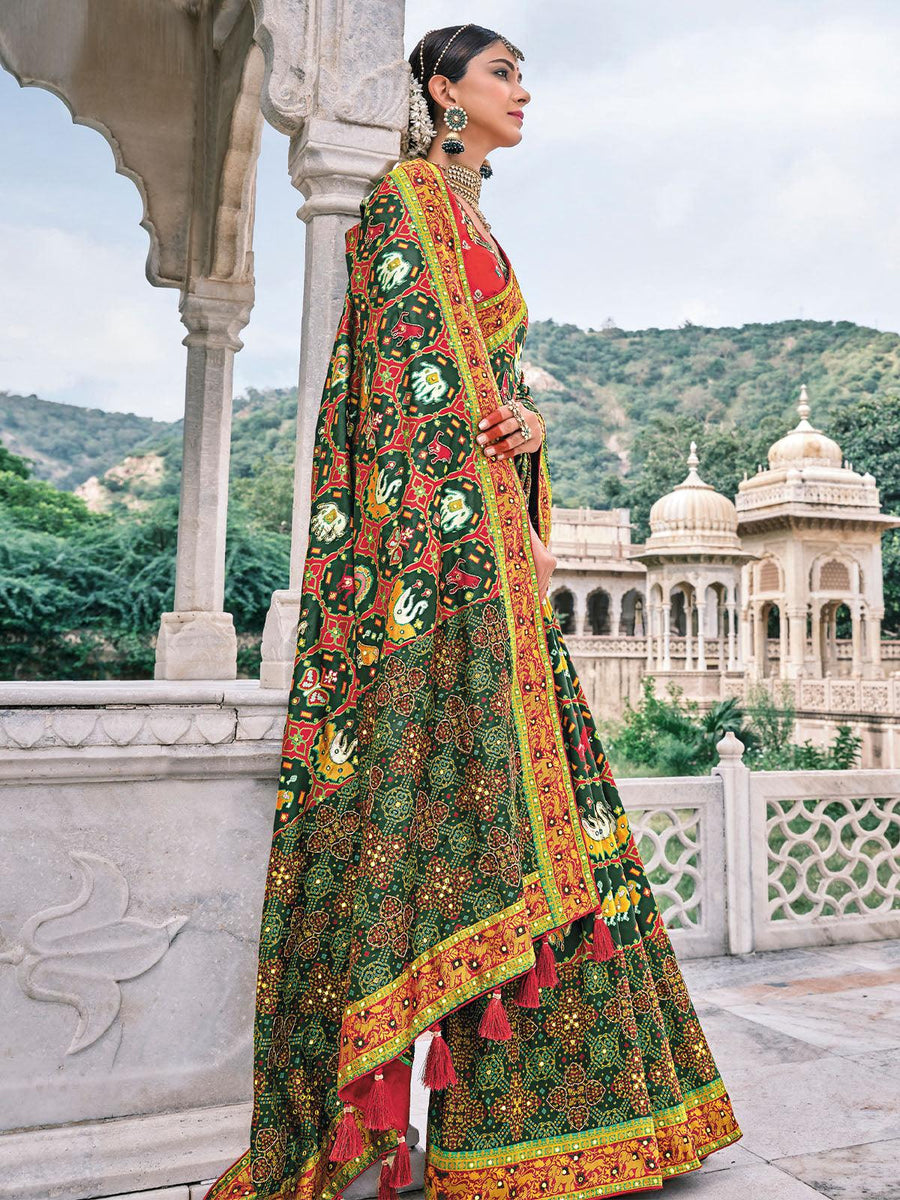 Bottle Green Patola pure silk saree with heavy aanchal golden and Red border and printed blouse (Unstitched)