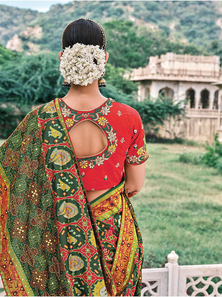 Bottle Green Patola pure silk saree with heavy aanchal golden and Red border and printed blouse (Unstitched)