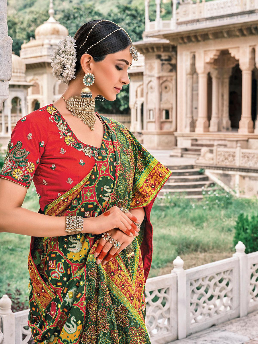 Bottle Green Patola pure silk saree with heavy aanchal golden and Red border and printed blouse (Unstitched)