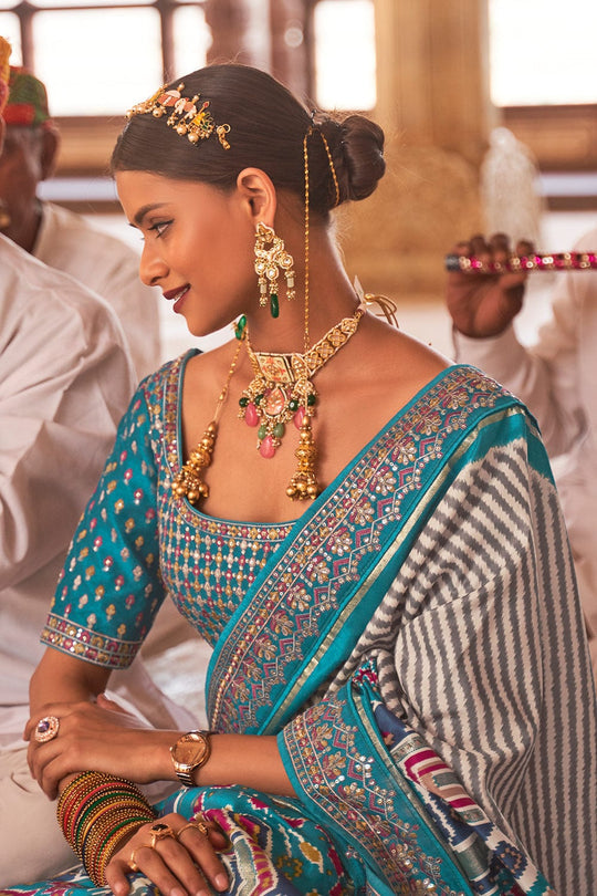 Blue Patola pure silk saree with heavy aanchal golden border and printed blouse (Unstitched)