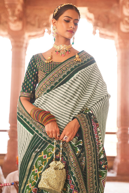 Bottle Green Patola pure silk saree with heavy aanchal golden border and printed blouse (Unstitched)