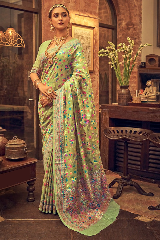 Pastel green pure silk saree with heavy aanchal golden border and printed blouse (Unstitched)