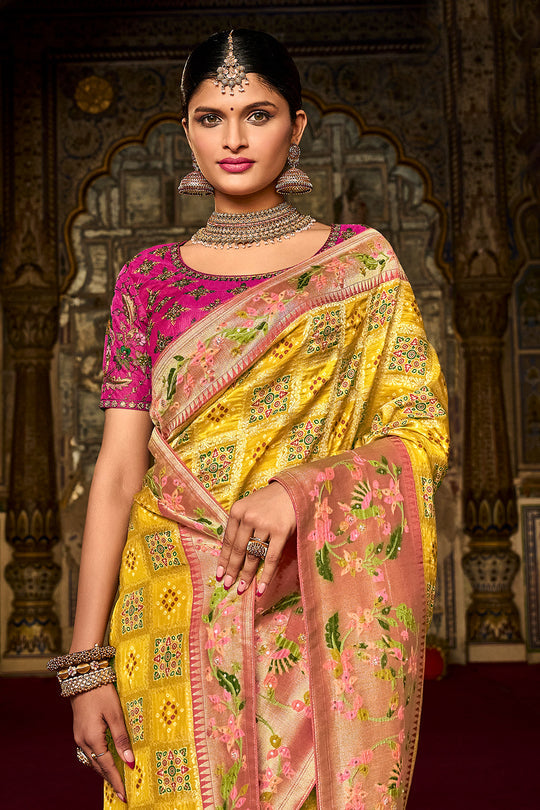 Yellow pure silk saree with heavy aanchal pink golden border and pink printed blouse (Unstitched)