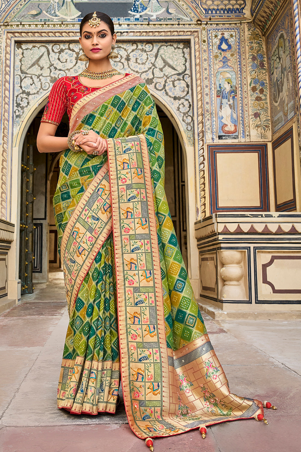 Green pure silk saree with heavy aanchal  golden border and red printed blouse (Unstitched)