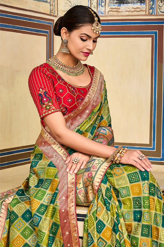 Green pure silk saree with heavy aanchal  golden border and red printed blouse (Unstitched)