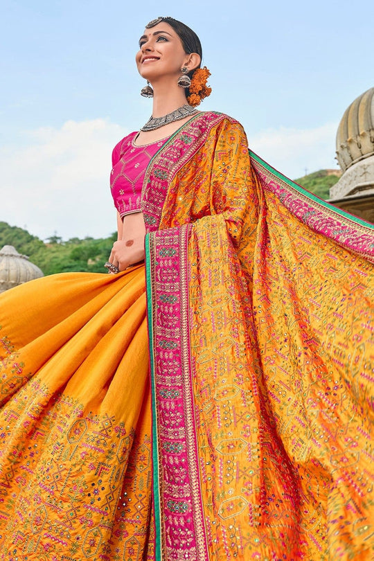 Yellow Banarasi pure silk saree with heavy aanchal pink border and printed blouse (Unstitched)