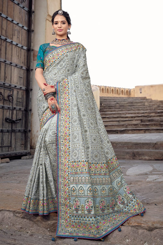 Grey pure silk saree with heavy aanchal golden border and blue printed blouse (Unstitched)