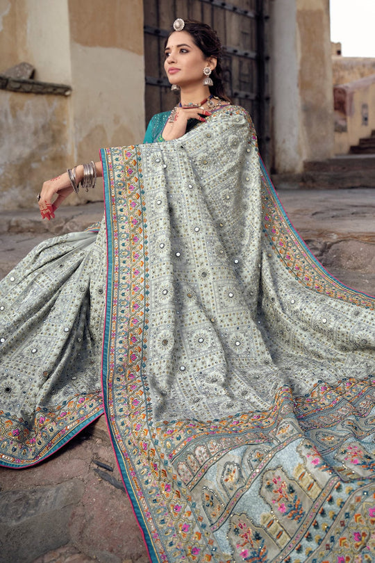 Grey pure silk saree with heavy aanchal golden border and blue printed blouse (Unstitched)