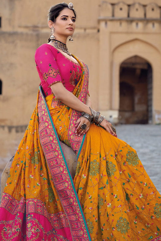 Orange pure silk saree with heavy aanchal pink golden border and pink printed blouse (Unstitched)