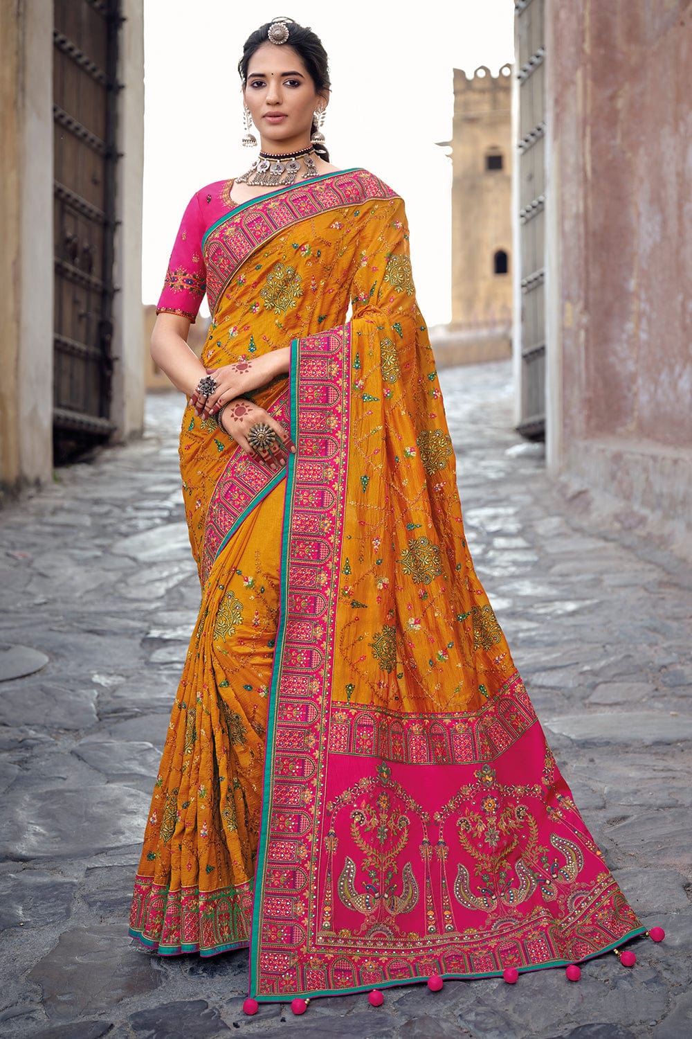 Orange pure silk saree with heavy aanchal pink golden border and pink printed blouse (Unstitched)