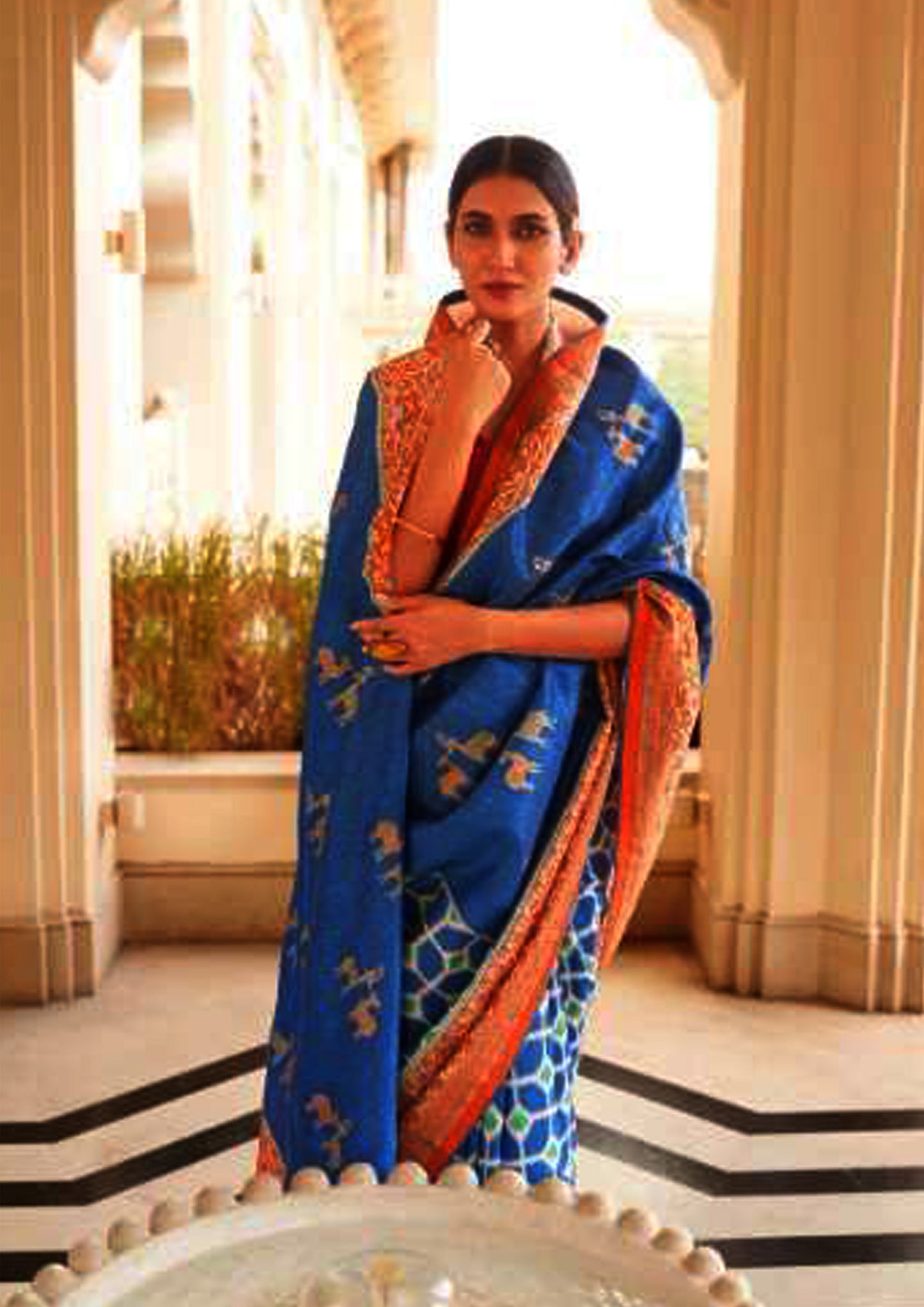 Royal Blue pure silk saree with red border and red colored blouse(unstitched)