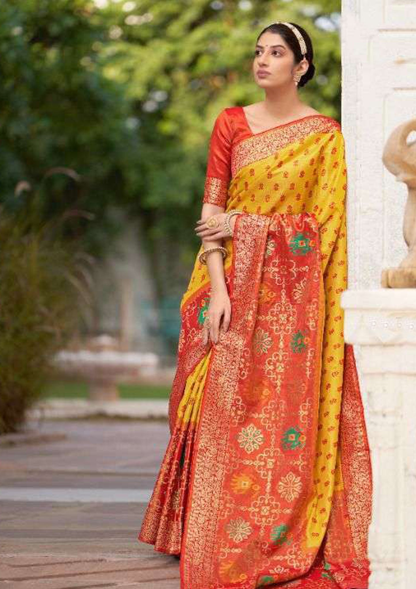 Yellow pure silk saree with red border and matching blouse (unstitched)