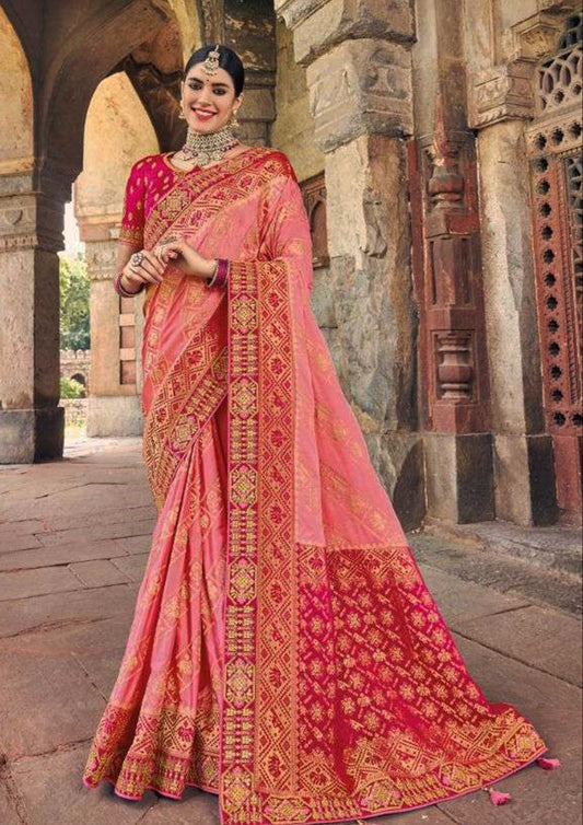 Pink pure silk saree with golden border and pink colored blouse (Unstitched)