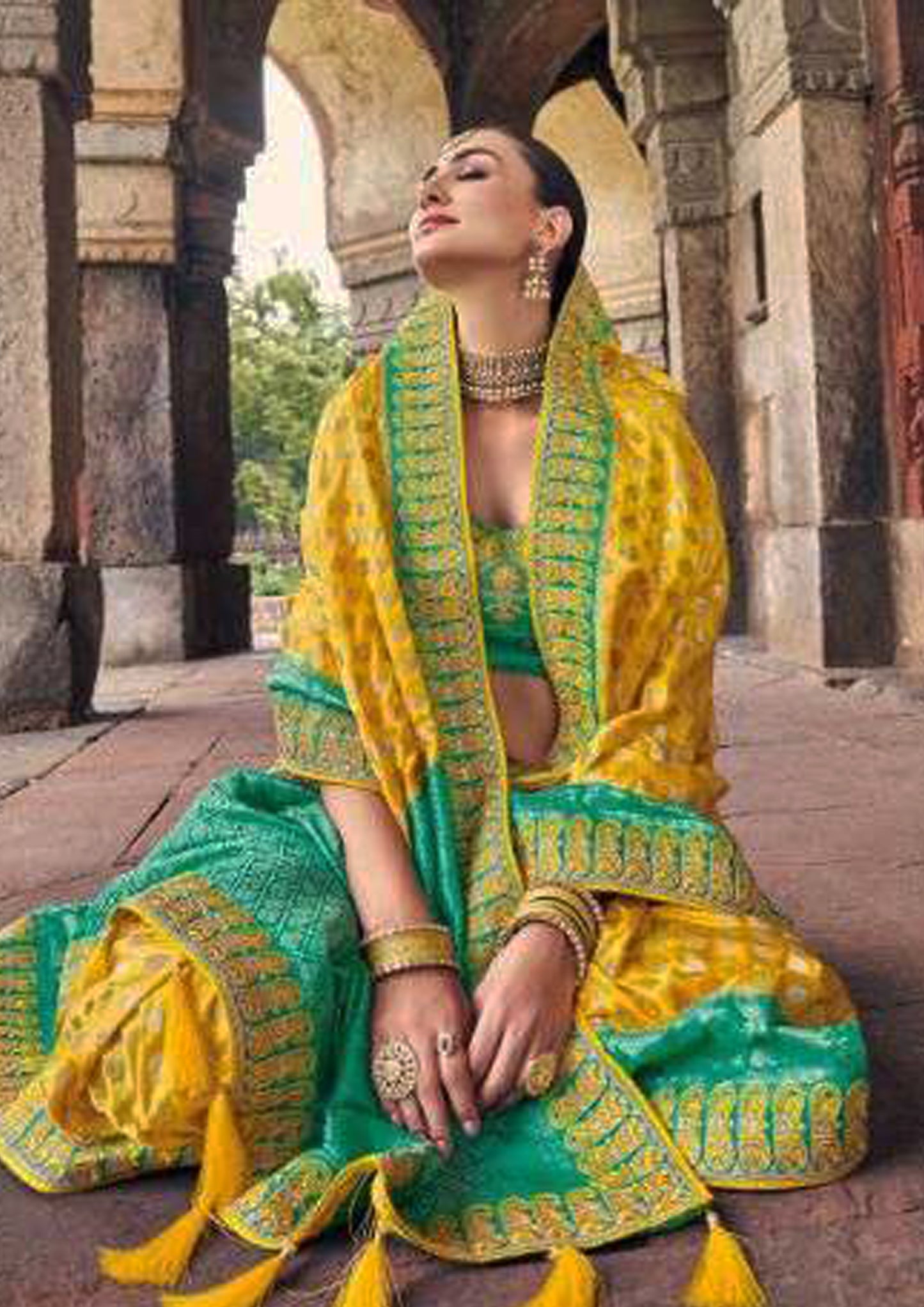 Yellow pure silk saree with patterned green blouse and border (Unstitched)