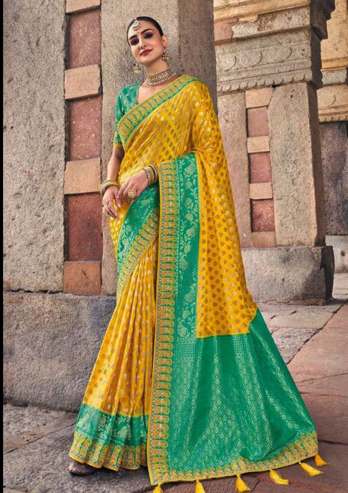 Yellow pure silk saree with patterned green blouse and border (Unstitched)