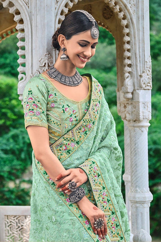 Green pure silk saree with heavy aanchal golden border and printed blouse (Unstitched)