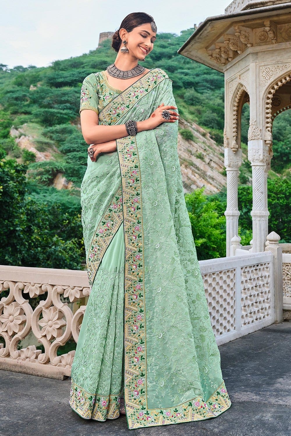 Green pure silk saree with heavy aanchal golden border and printed blouse (Unstitched)