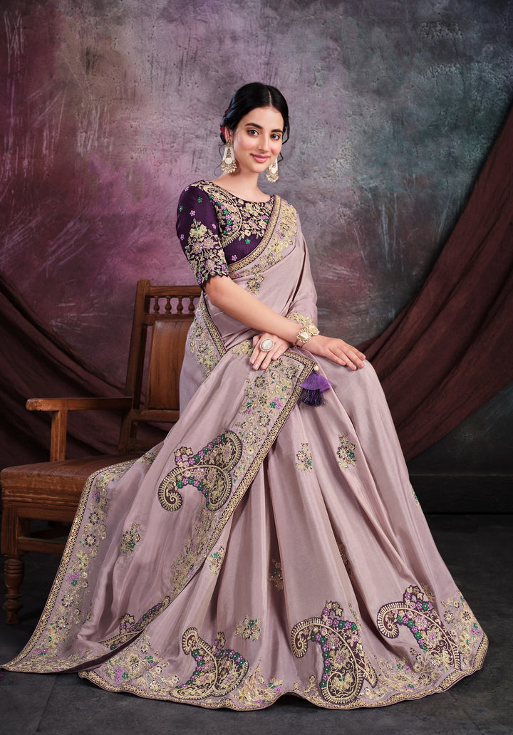 Light purple pure silk saree with heavy aanchal golden border and dark purple printed blouse (Unstitched)