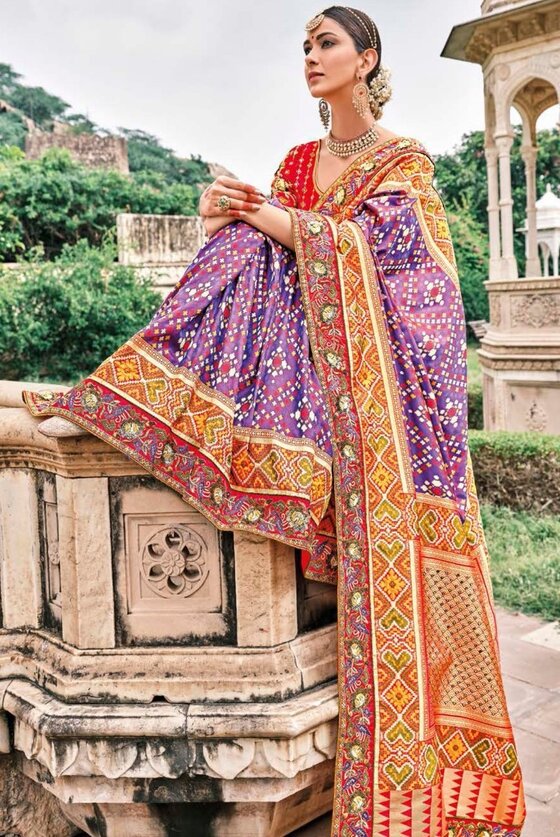 Purple Patola pure silk saree with heavy aanchal golden and Red border and printed blouse (Unstitched)