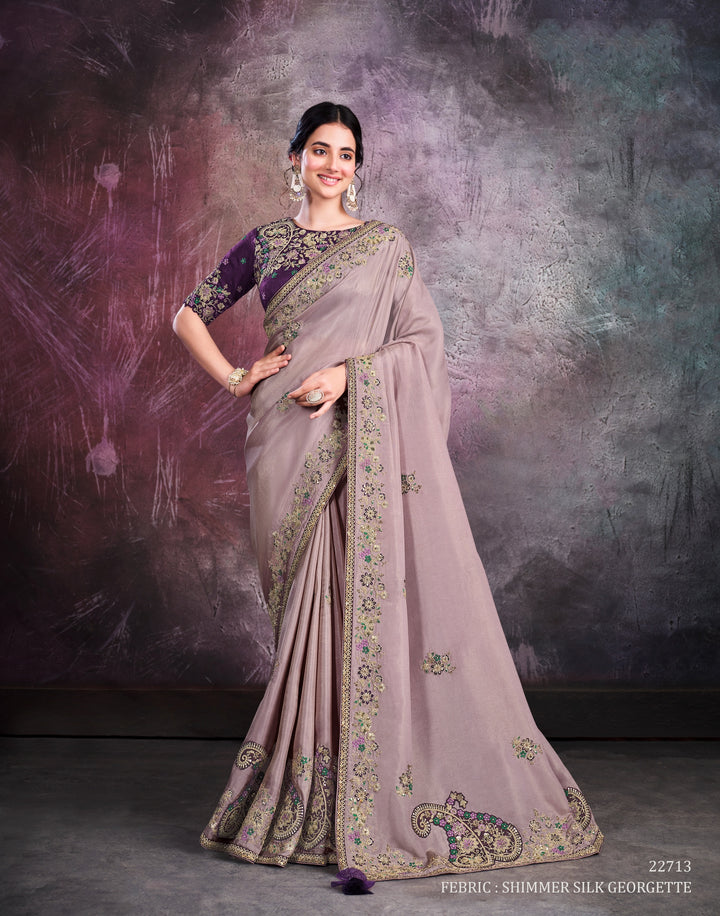 Light purple pure silk saree with heavy aanchal golden border and dark purple printed blouse (Unstitched)