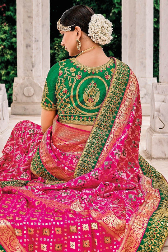 Pink Patola pure silk saree with heavy aanchal golden and Green border and printed blouse (Unstitched)