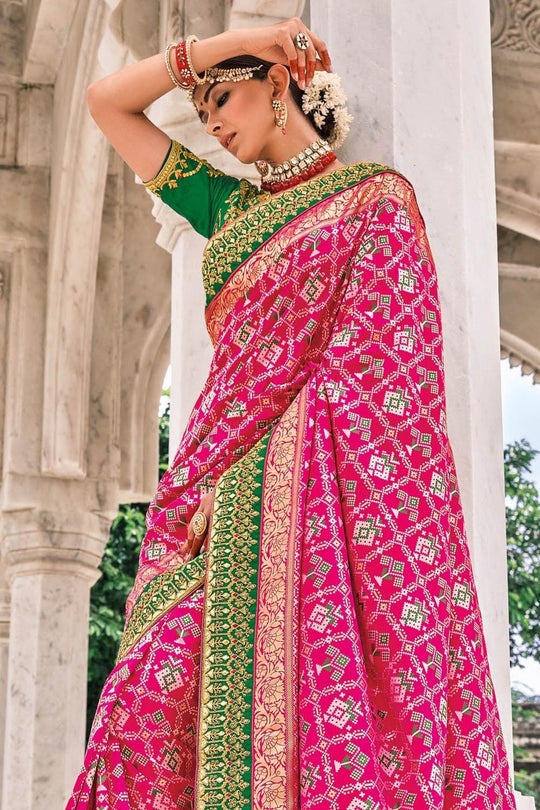 Pink Patola pure silk saree with heavy aanchal golden and Green border and printed blouse (Unstitched)