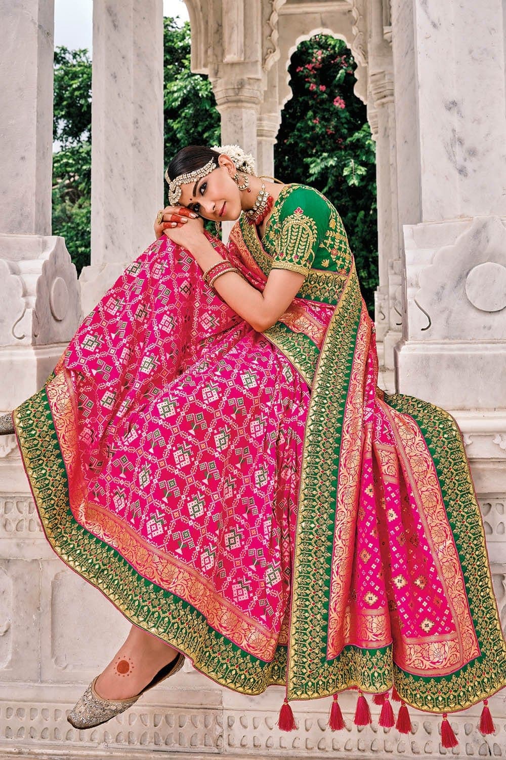 Pink Patola pure silk saree with heavy aanchal golden and Green border and printed blouse (Unstitched)