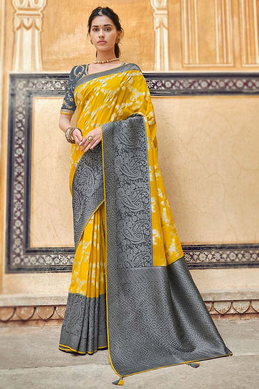 Yellow pure silk saree with heavy aanchal golden border and printed blouse (Unstitched)