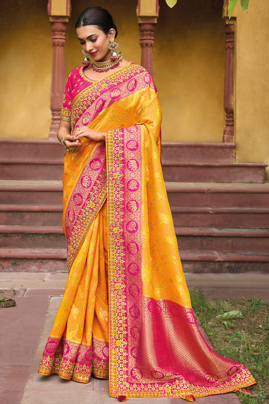 Yellow pure silk saree with heavy aanchal golden border and printed blouse (Unstitched)