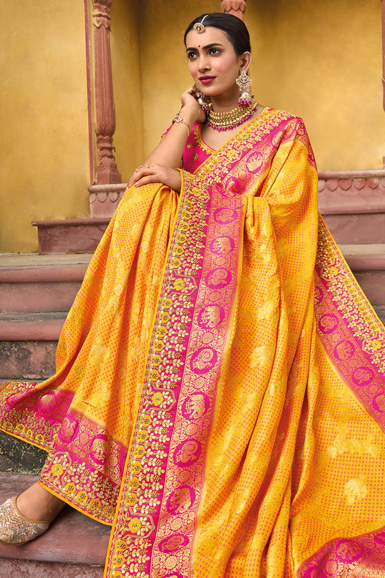 Yellow pure silk saree with heavy aanchal golden border and printed blouse (Unstitched)