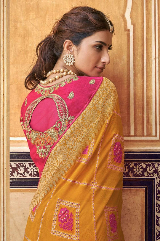 Orange pure silk saree with heavy aanchal golden border and printed blouse (Unstitched)