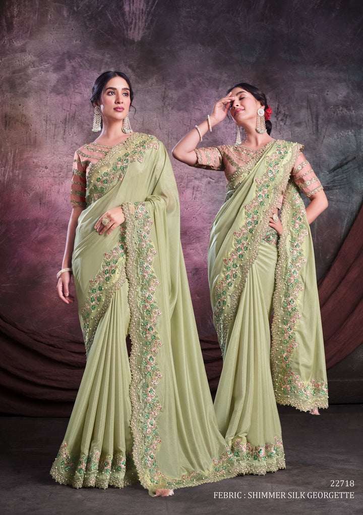 Pastel green pure silk saree with heavy aanchal golden border and nude pink printed blouse (Unstitched)