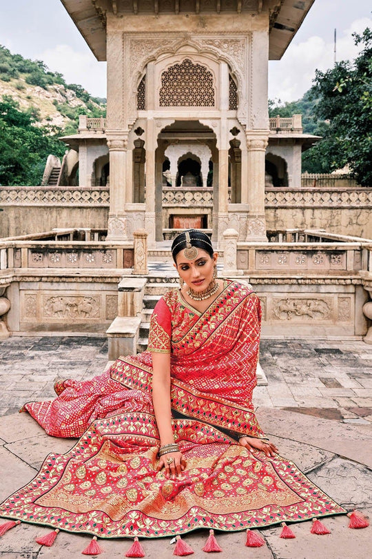 Red Patola pure silk saree with heavy aanchal Golden border and printed blouse (Unstitched)