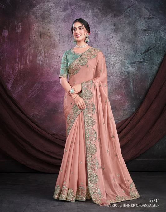 Peach pure silk saree with heavy aanchal green and golden border and light green printed blouse (Unstitched)