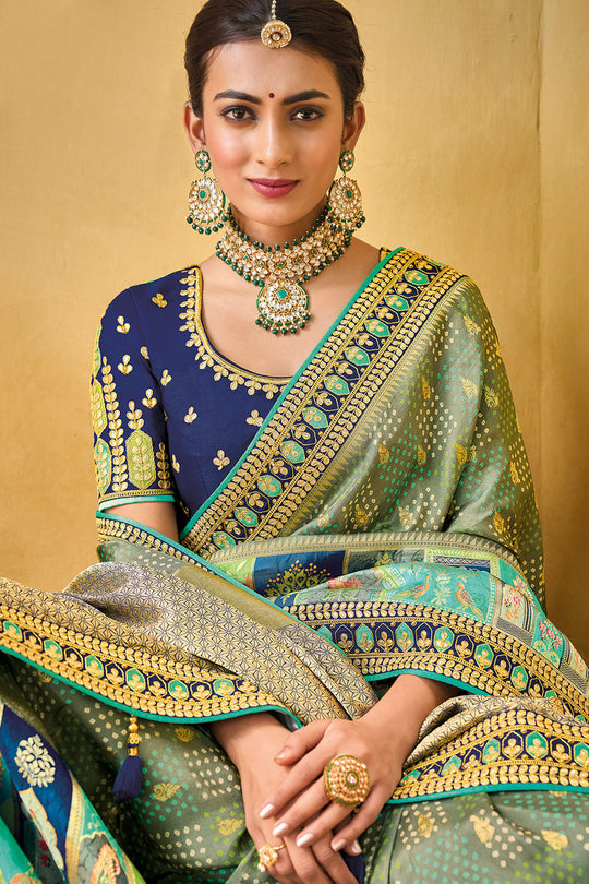 Light Green pure silk saree with heavy aanchal golden border and printed blouse (Unstitched)