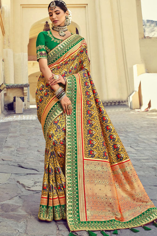 Yellow pure silk saree with heavy aanchal Green border and printed blouse (Unstitched)