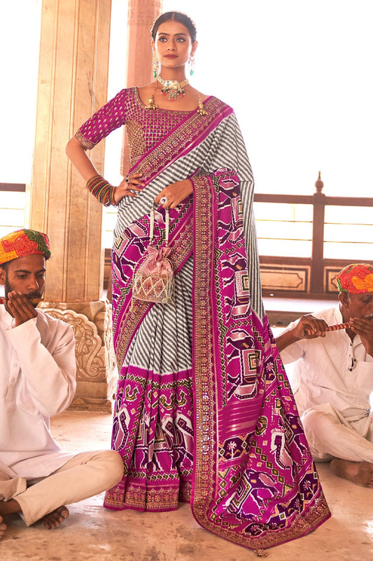 Purple Patola pure silk saree with heavy aanchal golden border and printed blouse (Unstitched)