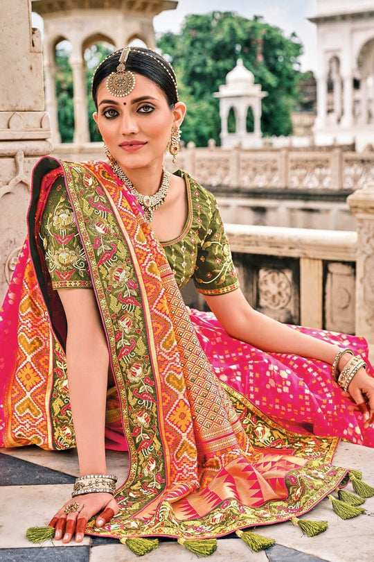 Pink and Orange Patola pure silk saree with heavy aanchal Green border and printed blouse (Unstitched)