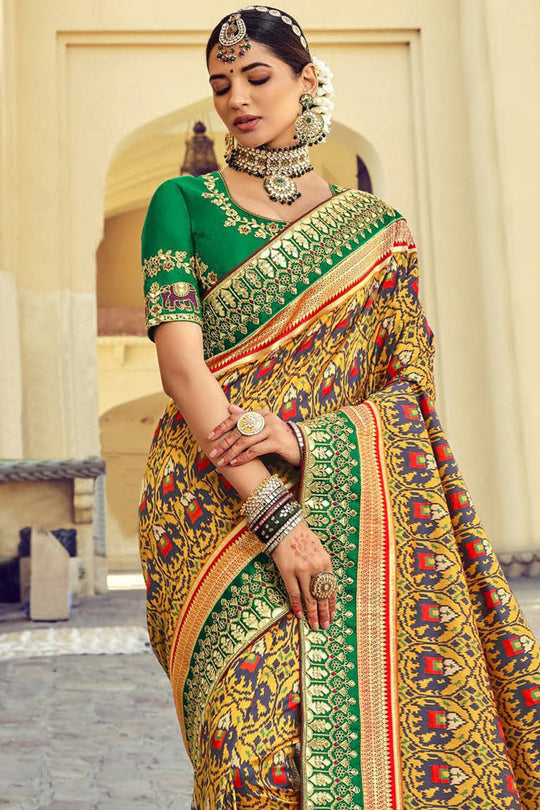 Yellow pure silk saree with heavy aanchal Green border and printed blouse (Unstitched)