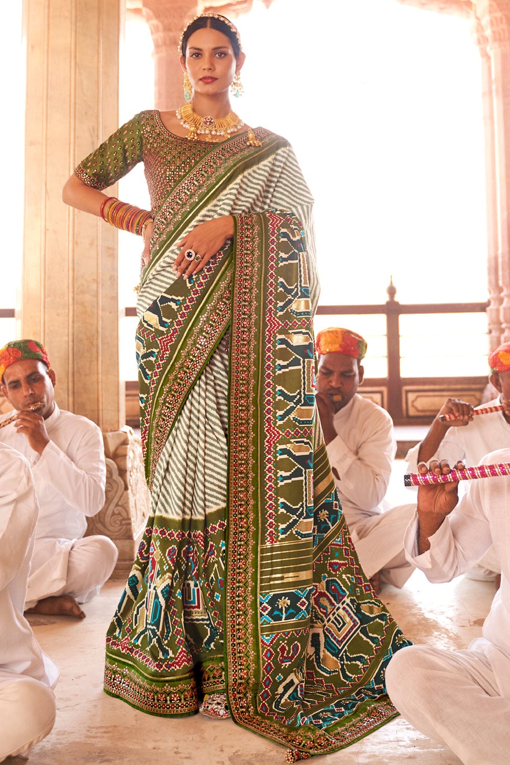 Green Patola pure silk saree with heavy aanchal golden border and printed blouse (Unstitched)