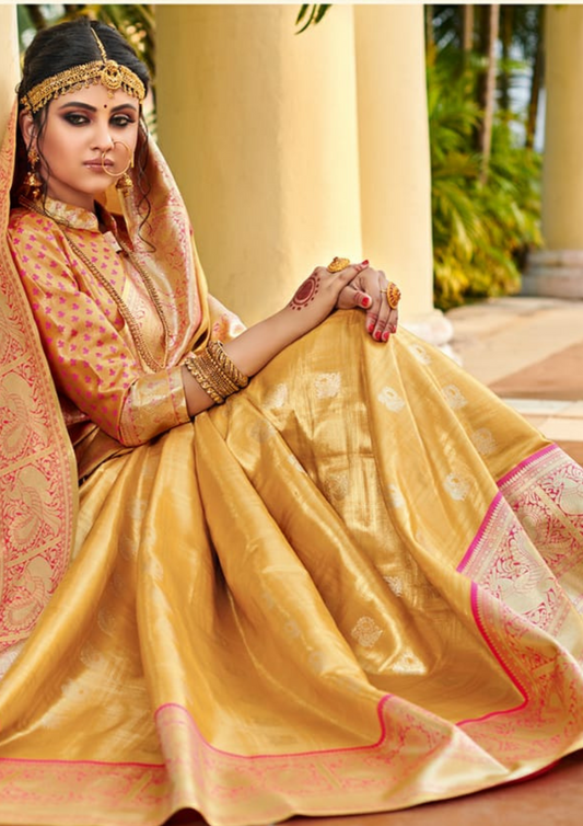 Yellow pure silk saree with heavy aanchal golden border and printed blouse (Unstitched)