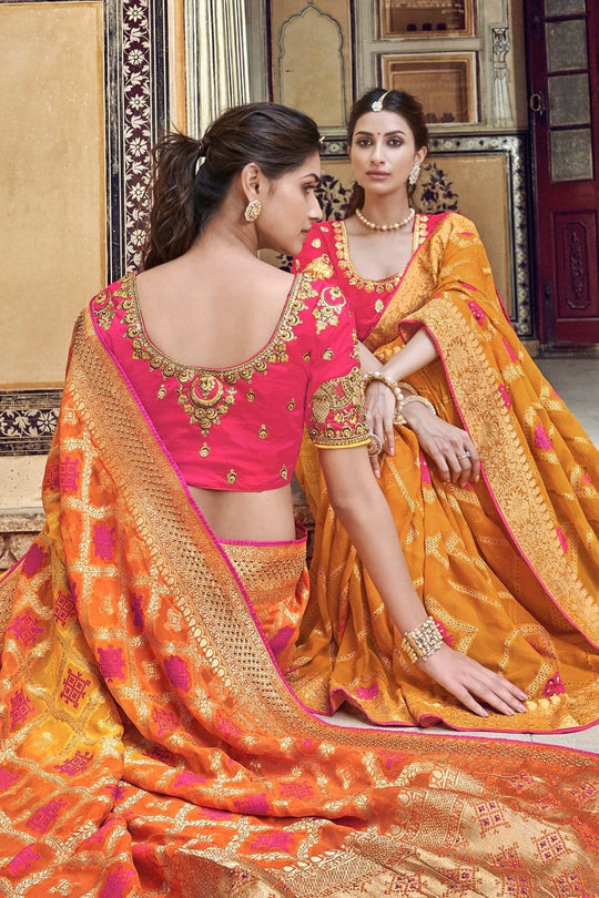 Orange pure silk saree with heavy aanchal golden border and printed blouse (Unstitched)