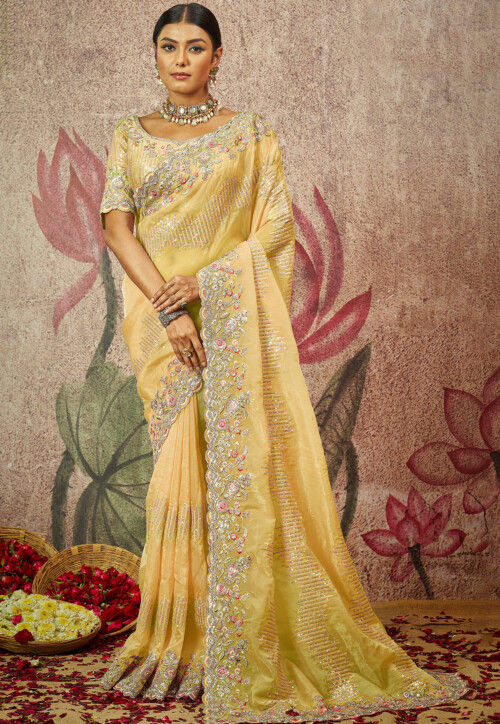 Yellow pure silk saree with heavy aanchal golden border and printed blouse (Unstitched)