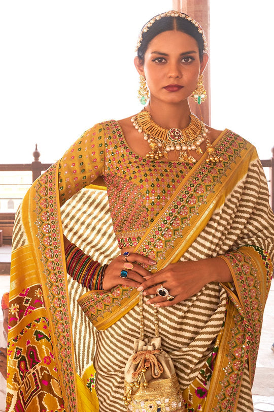 Yellow Patola pure silk saree with heavy aanchal golden border and printed blouse (Unstitched)