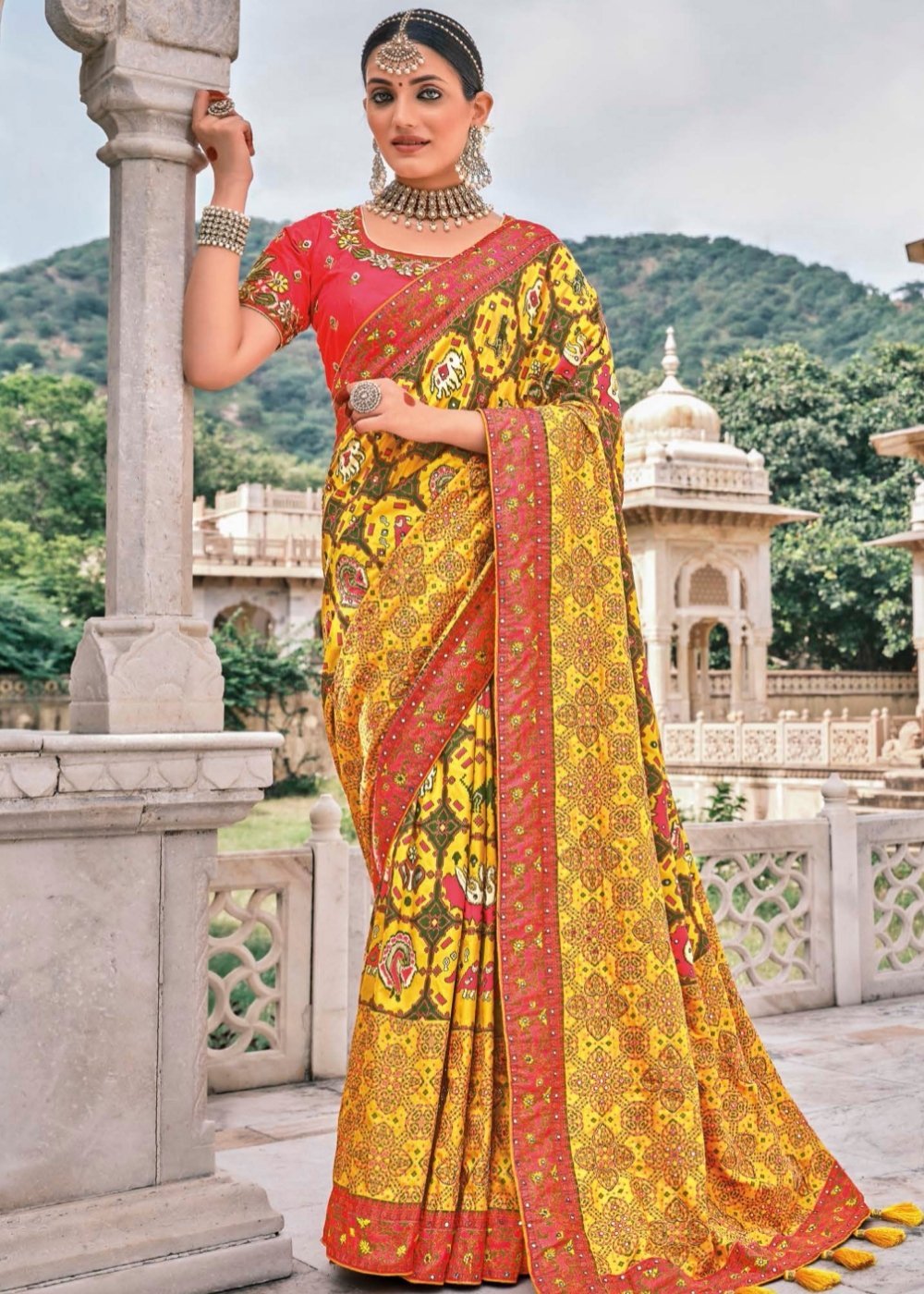 Yellow Patola pure silk saree with heavy aanchal Red border and printed blouse (Unstitched)