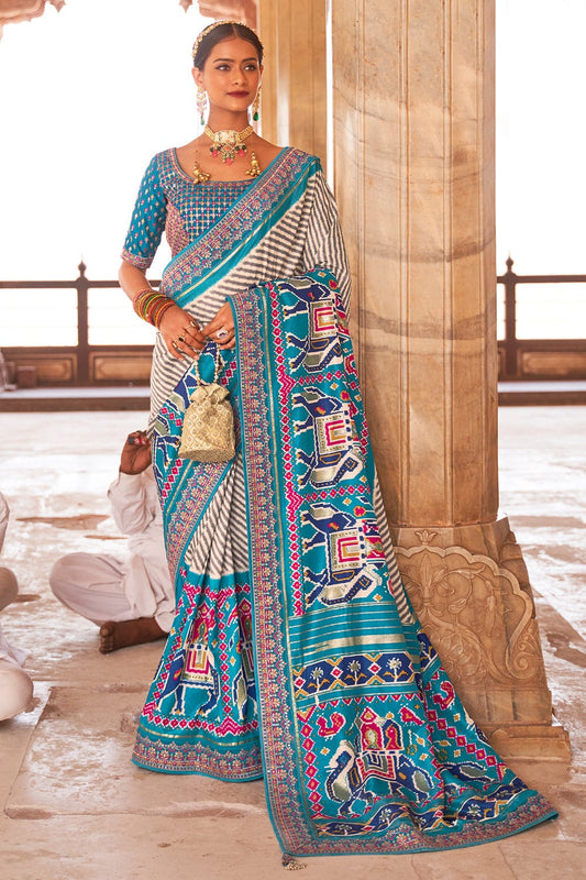 Blue Patola pure silk saree with heavy aanchal golden border and printed blouse (Unstitched)