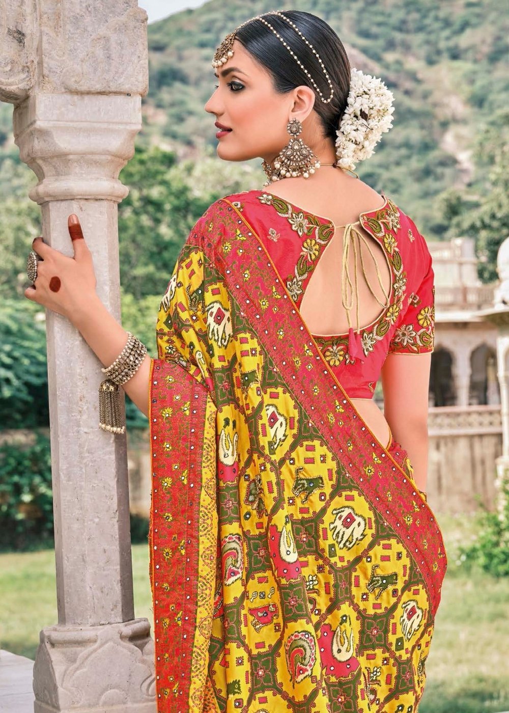 Yellow Patola pure silk saree with heavy aanchal Red border and printed blouse (Unstitched)